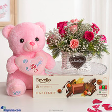 Blissful Pink Embrace Combo Pack -  Flower Arrangement With Revello Finemelts Hazelnut Chocolate 300g And  Pink Bear Buy combo gift pack Online for specialGifts